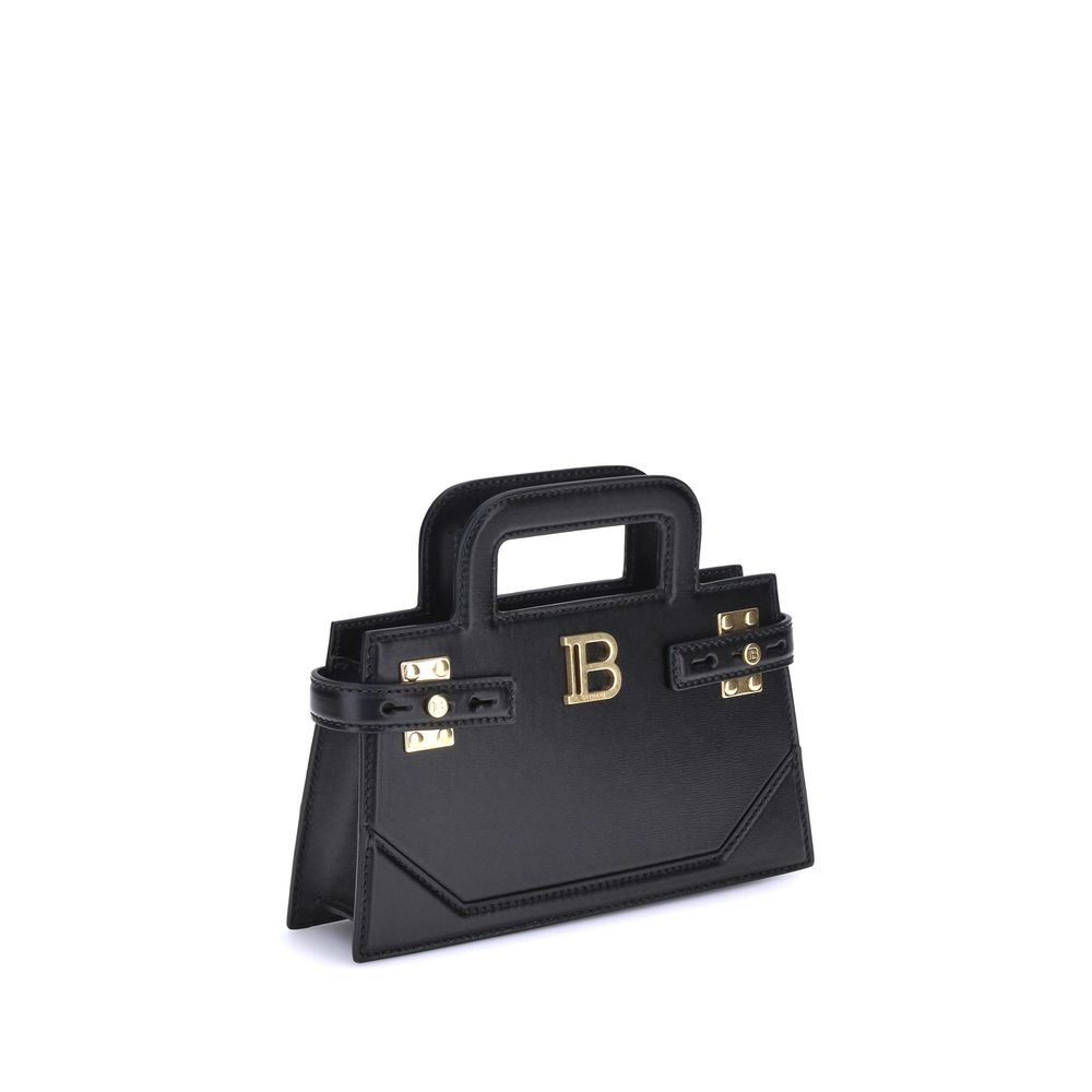 B-buzz Small HandbagBalmain’s B-Buzz small Handbag features two top handles and a removable chain strap, adding to its versatility. The metal 