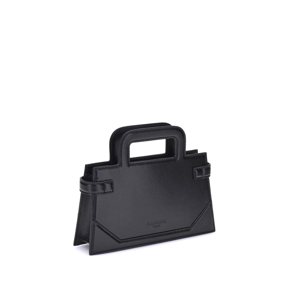 B-buzz Small HandbagBalmain’s B-Buzz small Handbag features two top handles and a removable chain strap, adding to its versatility. The metal 