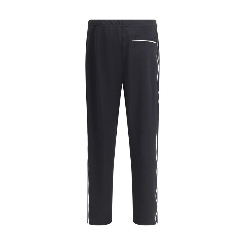 Black Polyester Joggers (Workout Pants)Kenzo Sweatpants made of comfortable fabric with a casual cut. The model features an adjustable elastic waistband with internal drawstring, two side slash pockets and a welt pocket with zipper closure on the back. On