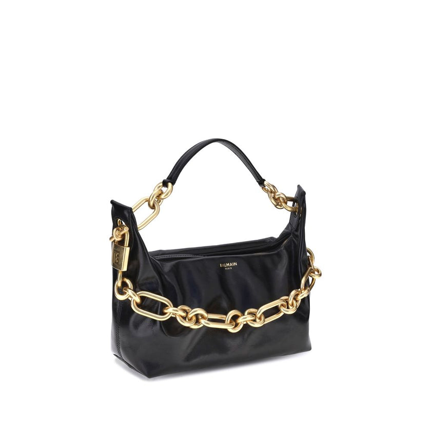 Black Calf Leather Bos Taurus Shoulder BagBalmain’s leather Sync Shoulder Bag combines bold elegance with iconic details. Featuring double handles, one in gold chain and the other in leather; it has a top zipper closure and leather slider for a practical
