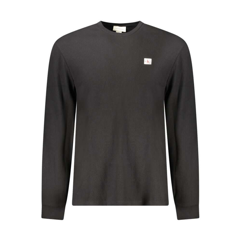 Black Cotton Men SweaterElevate your wardrobe with a timeless staple that exudes modern sophistication. This Calvin Klein long-sleeved T-shirt boasts the perfect blend of style and comfort, making it an essential addition to any fashion-forward ensemble.