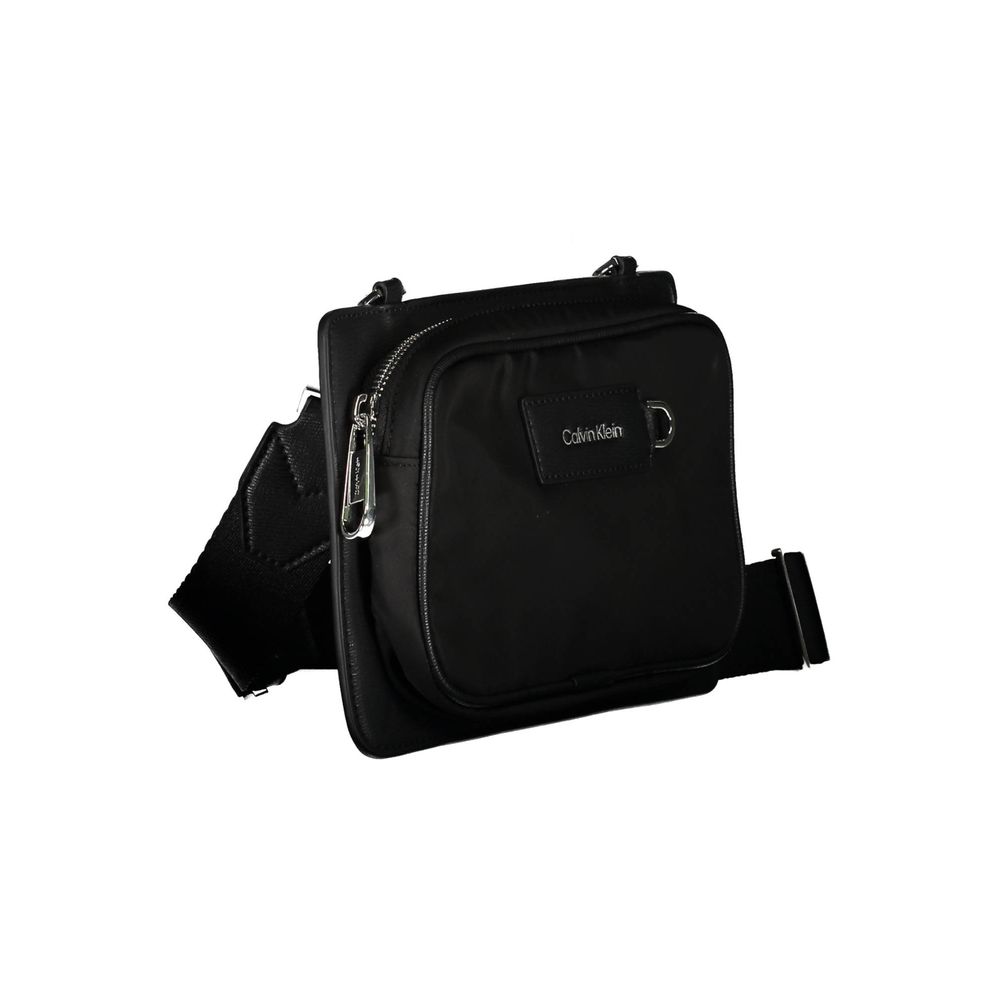 Black Polyester Shoulder Bagadjustable and removable shoulder strap. 1 external pocket, contrasting details, zip closure, logo, 60% recycled polyesterBlack Polyester Shoulder Bag${tagsCalvin KleinAulae Black Polyester Shoulder Bag Calvin KleinAulae Black