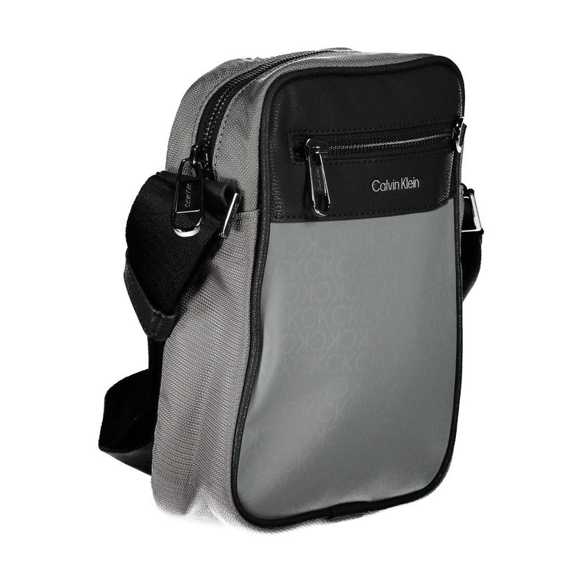 Gray Polyester Shoulder Bagadjustable shoulder strap, 1 external pocket, 1 internal pocket, contrasting details, zip closure, logo, 100% recycled polyesterGray Polyester Shoulder Bag${tagsCalvin KleinAulae Gray Polyester Shoulder Bag Calvin KleinAulae Gra