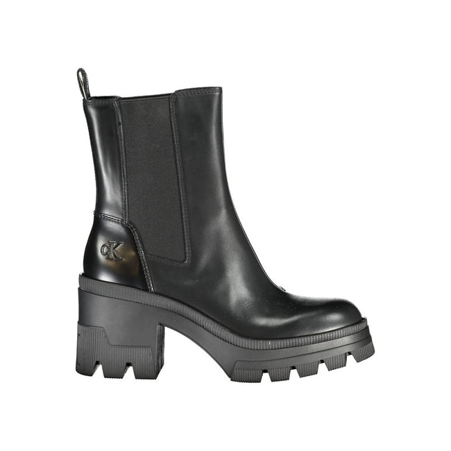 Black Leather Women BootElevate your ensemble with the epitome of chic – Calvin Klein boots that blend sophistication with a touch of the avant-garde. Tower above the trendsetters with an 8 cm heel that promises poise and presence. The striking print and