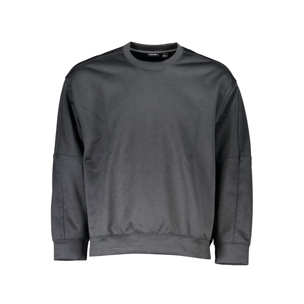 Black Polyester Men SweaterCrafted for the modern fashion maverick, this sleek Calvin Klein sweatshirt is emblematic of urban sophistication. Adorned with the iconic CK logo, this piece merges the comfort of long sleeves with the utility of zip pockets. C