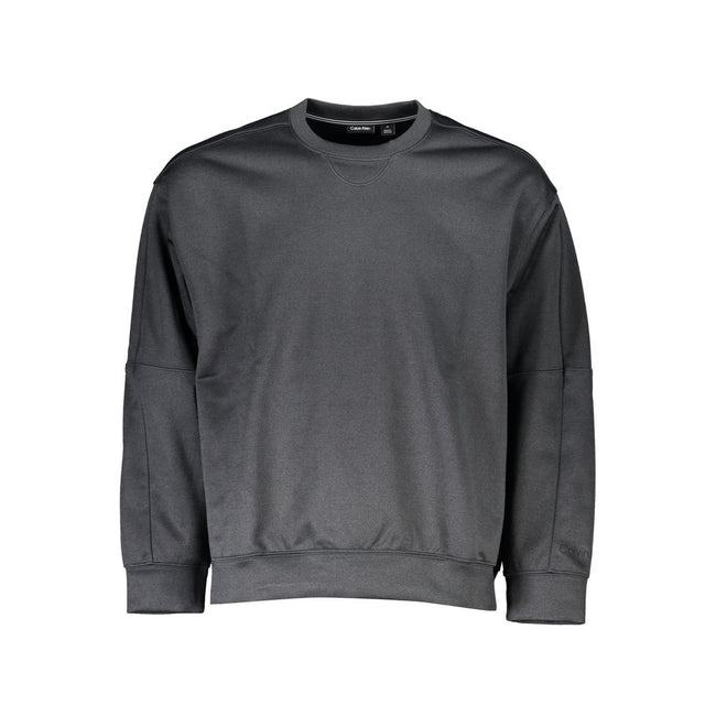 Black Polyester Men SweaterCrafted for the modern fashion maverick, this sleek Calvin Klein sweatshirt is emblematic of urban sophistication. Adorned with the iconic CK logo, this piece merges the comfort of long sleeves with the utility of zip pockets. C