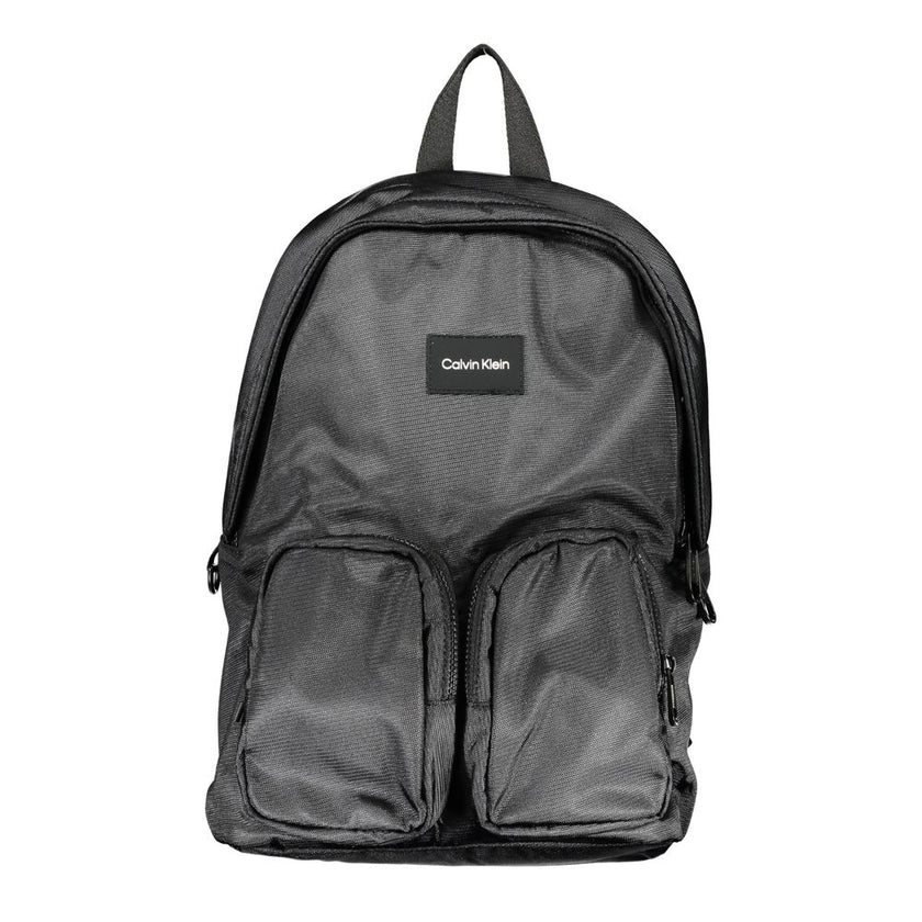 Black Polyester BackpackBACKPACK 1 HANDLE, ADJUSTABLE STRAPS, 2 EXTERNAL POCKETS, 1 LAP-TOP COMPARTMENT, 1 INTERNAL POCKET, CONTRASTING DETAILS, ZIP CLOSURE, LOGO, 50% RECYCLED POLYESTERBlack Polyester Backpack${tagsCalvin KleinAulae Black Polyester Backp