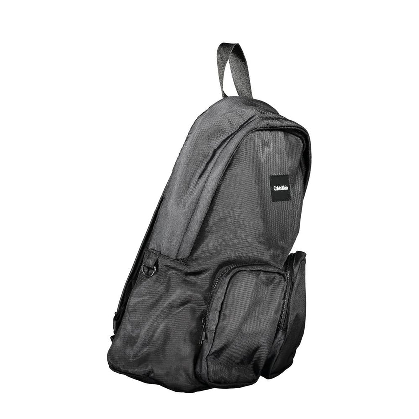 Black Polyester BackpackBACKPACK 1 HANDLE, ADJUSTABLE STRAPS, 2 EXTERNAL POCKETS, 1 LAP-TOP COMPARTMENT, 1 INTERNAL POCKET, CONTRASTING DETAILS, ZIP CLOSURE, LOGO, 50% RECYCLED POLYESTERBlack Polyester Backpack${tagsCalvin KleinAulae Black Polyester Backp