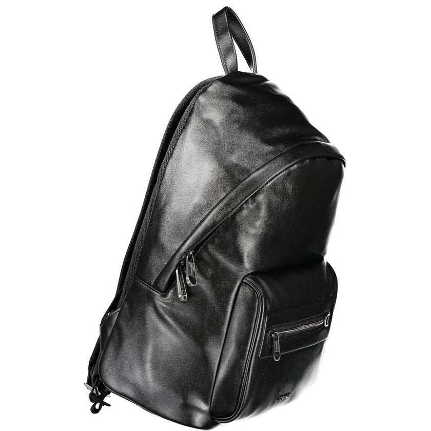 Black Polyester BackpackBACKPACK 1 HANDLE, ADJUSTABLE STRAPS, 1 EXTERNAL POCKET, 1 LAP-TOP COMPARTMENT, 1 INTERNAL POCKET, CONTRASTING DETAILS, ZIP CLOSURE, LOGO, 50% RECYCLED POLYESTERBlack Polyester Backpack${tagsCalvin KleinAulae Black Polyester Backpa