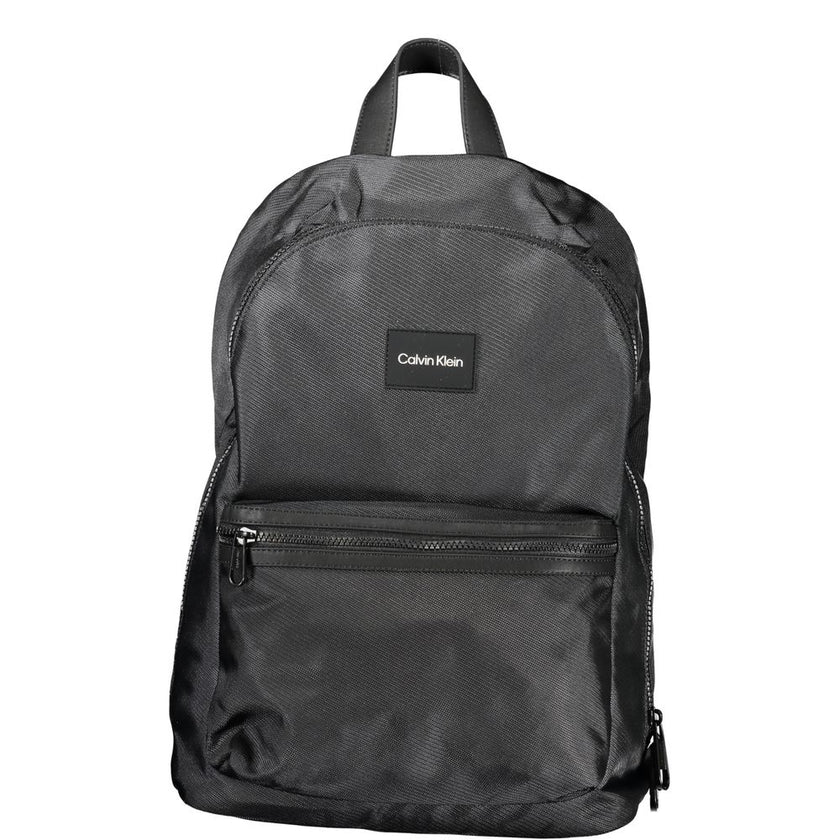 Black Polyester BackpackBACKPACK 1 HANDLE, ADJUSTABLE STRAPS, 1 EXTERNAL POCKET, 1 INTERNAL POCKET, LAP-TOP COMPARTMENT, PEN HOLDER SPACES, ZIP CLOSURE, LOGO, RECYCLED POLYESTERBlack Polyester Backpack${tagsCalvin KleinAulae Black Polyester Backpack Calvi