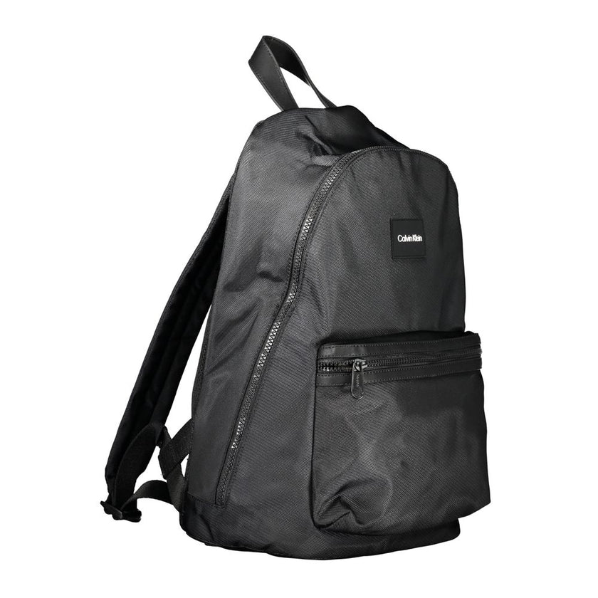 Black Polyester BackpackBACKPACK 1 HANDLE, ADJUSTABLE STRAPS, 1 EXTERNAL POCKET, 1 INTERNAL POCKET, LAP-TOP COMPARTMENT, PEN HOLDER SPACES, ZIP CLOSURE, LOGO, RECYCLED POLYESTERBlack Polyester Backpack${tagsCalvin KleinAulae Black Polyester Backpack Calvi