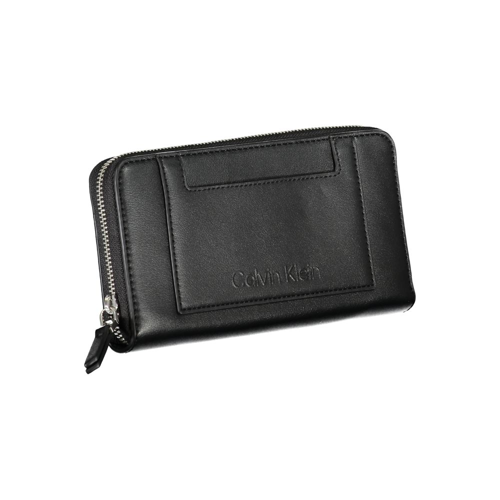 Black Polyester WalletWALLET WITH 5 COMPARTMENTS, COIN PURSE, DOUBLE SPACES FOR CARDS, 1 EXTERNAL POCKET, CONTRASTING DETAILS, ZIP CLOSURE, LOGO, 50% RECYCLED POLYESTERBlack Polyester Wallet${tagsCalvin KleinAulae Black Polyester Wallet Calvin KleinAulae