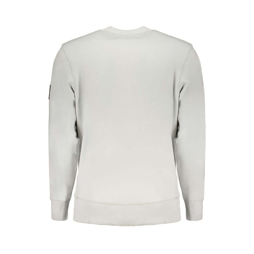 Gray Cotton Men SweaterUnleash the epitome of urban sophistication with this Calvin Klein masterpiece. A symphony of style and sustainability, this long sleeve sweatshirt is your ticket to effortless fashion. Its crew neck design and brushed interior boas
