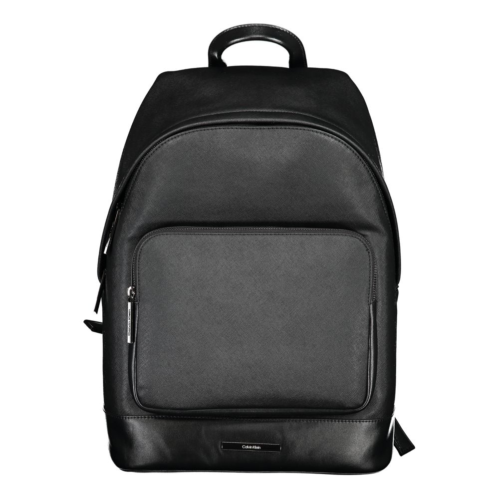 Black Polyester BackpackBACKPACK 1 HANDLE, ADJUSTABLE STRAPS, 1 EXTERNAL POCKET, 1 INTERNAL POCKET, 1 LAP-TOP COMPARTMENT, CONTRASTING DETAILS, ZIP CLOSURE, PROTECTIVE FEET, LOGO, 50% RECYCLED POLYESTERBlack Polyester Backpack${tagsCalvin KleinAulae Black