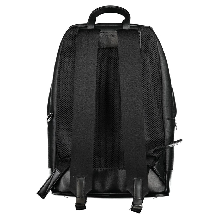 Black Polyester BackpackBACKPACK 1 HANDLE, ADJUSTABLE STRAPS, 1 EXTERNAL POCKET, 1 INTERNAL POCKET, 1 LAP-TOP COMPARTMENT, CONTRASTING DETAILS, ZIP CLOSURE, PROTECTIVE FEET, LOGO, 50% RECYCLED POLYESTERBlack Polyester Backpack${tagsCalvin KleinAulae Black