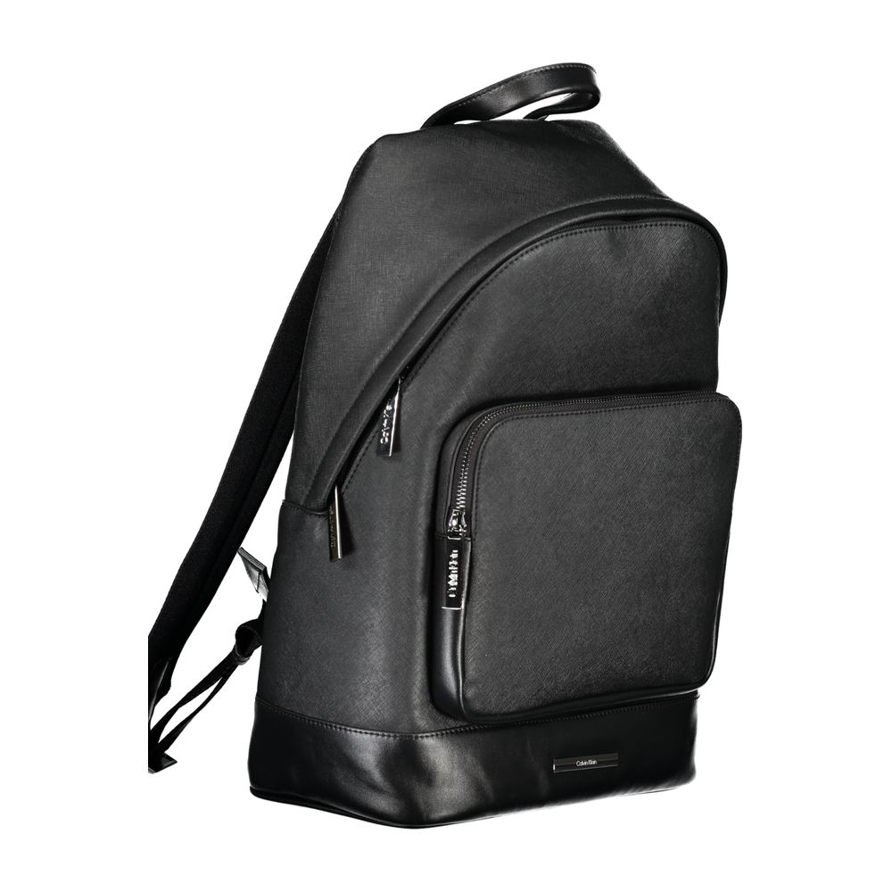 Black Polyester BackpackBACKPACK 1 HANDLE, ADJUSTABLE STRAPS, 1 EXTERNAL POCKET, 1 INTERNAL POCKET, 1 LAP-TOP COMPARTMENT, CONTRASTING DETAILS, ZIP CLOSURE, PROTECTIVE FEET, LOGO, 50% RECYCLED POLYESTERBlack Polyester Backpack${tagsCalvin KleinAulae Black