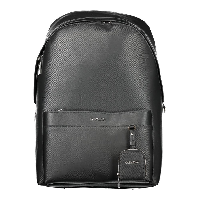 Black Polyester BackpackBACKPACK 1 HANDLE, ADJUSTABLE SHOULDER STRAPS, 1 EXTERNAL POCKET, 1 REMOVABLE EXTERNAL COIN PURSE, 1 INTERNAL COMPARTMENT, CONTRASTING DETAILS, ZIP CLOSURE, LOGO, 50% RECYCLED POLYESTERBlack Polyester Backpack${tagsCalvin KleinAula