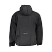 Black Cotton Men's JacketIntroducing the sleek and versatile Calvin Klein sports jacket – the ultimate fusion of functionality and style. Crafted for those who dare to stand out, this black jacket boasts long sleeves, a practical hood, and a smart zip clo