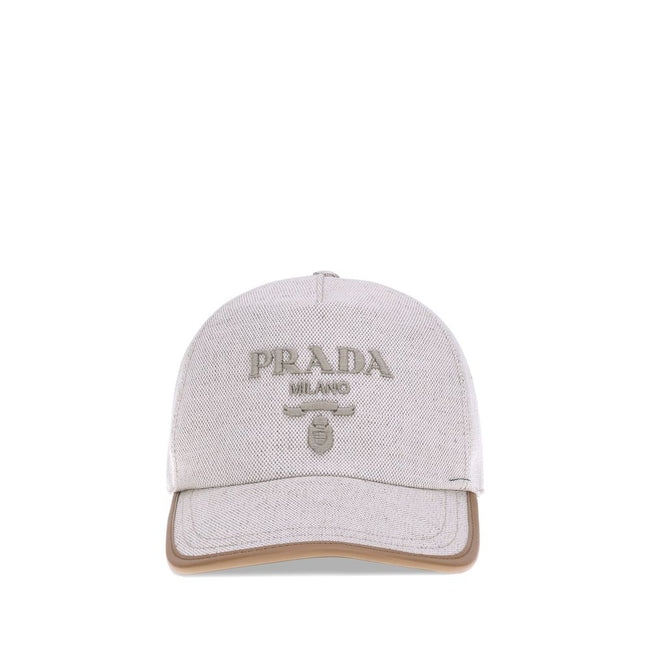 Beige Cotton Cap (Baseball Hat)Cotton Baseball Hat by Prada features an adjustable back closure for a perfect fit. The iconic embroidered monogram stands out on the front, giving a distinctive and refined touch to the classic design. A versatile and styli