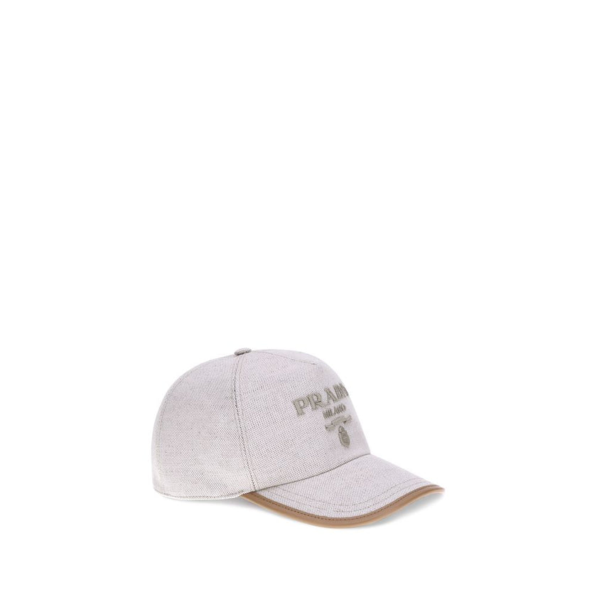 Beige Cotton Cap (Baseball Hat)Cotton Baseball Hat by Prada features an adjustable back closure for a perfect fit. The iconic embroidered monogram stands out on the front, giving a distinctive and refined touch to the classic design. A versatile and styli