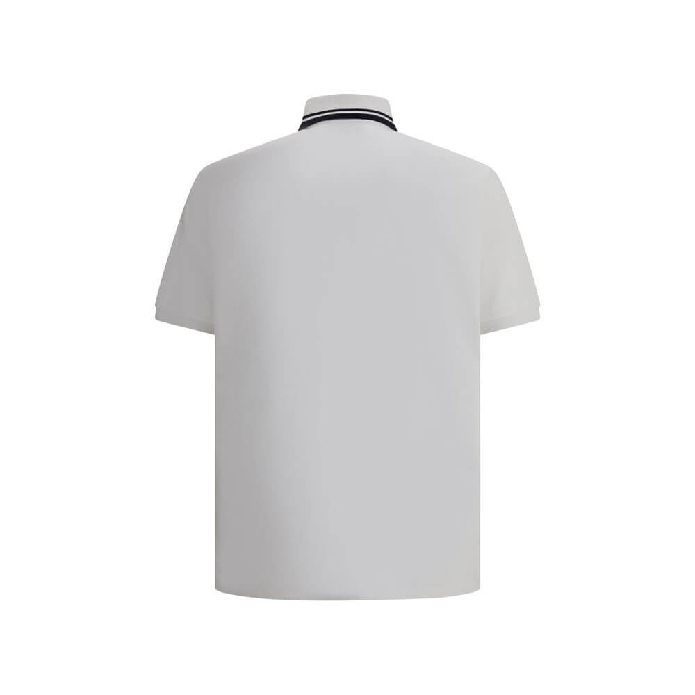 Logoed Polo ShirtCotton Polo Shirt by Gucci, perfect for a casual yet detail-oriented style. It features a classic collar with contrasting piping, buttons on the front and a logoed welt pocket applied to the chest. Side slits provide added comfort and fre