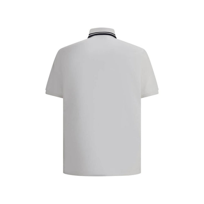 Logoed Polo ShirtCotton Polo Shirt by Gucci, perfect for a casual yet detail-oriented style. It features a classic collar with contrasting piping, buttons on the front and a logoed welt pocket applied to the chest. Side slits provide added comfort and fre