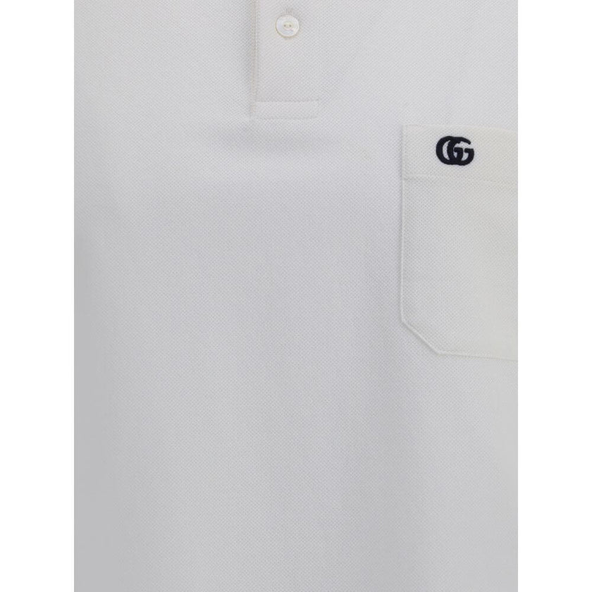 Logoed Polo ShirtCotton Polo Shirt by Gucci, perfect for a casual yet detail-oriented style. It features a classic collar with contrasting piping, buttons on the front and a logoed welt pocket applied to the chest. Side slits provide added comfort and fre