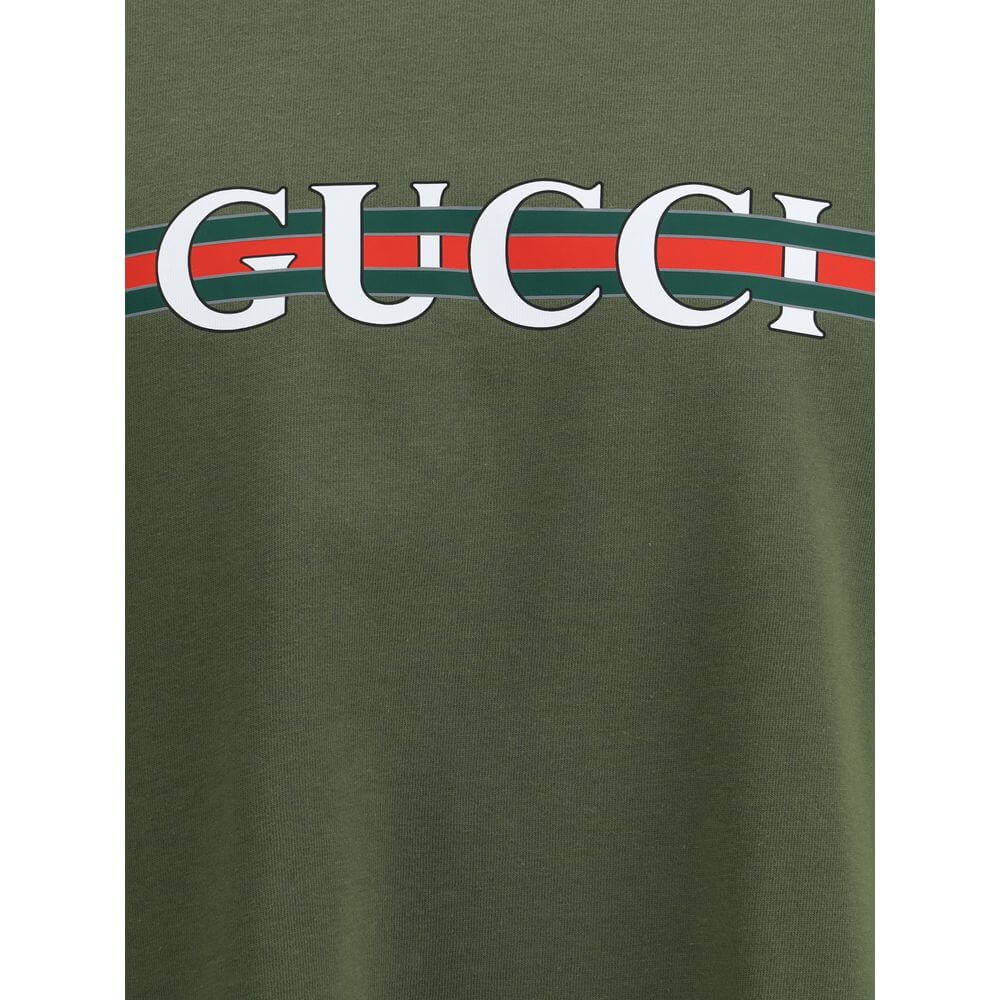 Logoed T-ShirtCotton T-Shirt by Gucci with an essential and recognizable design. Featuring a classic ribbed crew neck, it features the iconic contrasting monogram printed on the front, a distinctive detail that enhances the garment with a touch of timeles