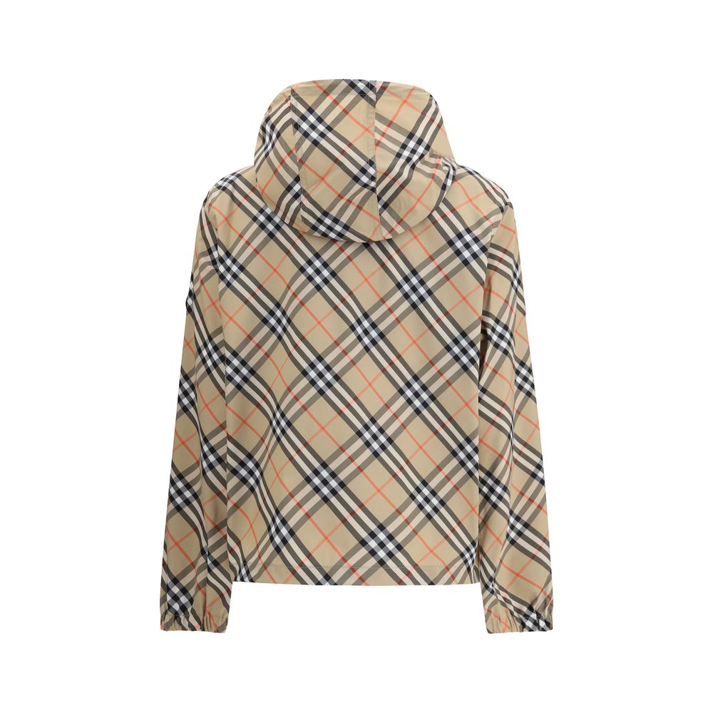 Beige Polyester Shell JacketBurberry’s waterproof Jacket combines functionality with iconic style. Equipped with an adjustable drawstring hood, it features the famous Archivio Check pattern that recalls the brand’s heritage. The front zipper closure and t