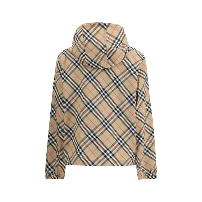 Beige Polyester Shell JacketBurberry’s waterproof Jacket combines functionality with iconic style. Equipped with an adjustable drawstring hood, it features the famous Archivio Check pattern that recalls the brand’s heritage. The front zipper closure and t