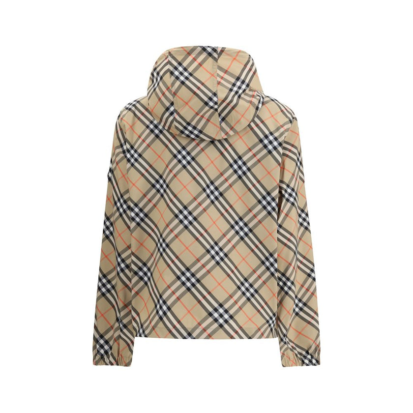 Beige Polyester Shell JacketBurberry’s waterproof Jacket combines functionality with iconic style. Equipped with an adjustable drawstring hood, it features the famous Archivio Check pattern that recalls the brand’s heritage. The front zipper closure and t