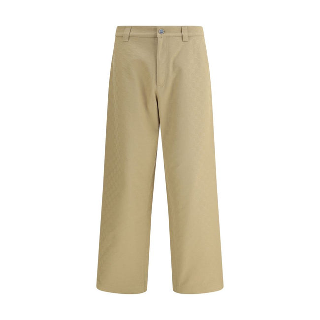 Beige Cotton Casual PantsGucci’s cotton Pants combine a functional design with a distinctive aesthetic. Featuring an all-over GG pattern, they feature belt loops, a carpenter-style pocket and back pockets. The button and zipper closure completes the look