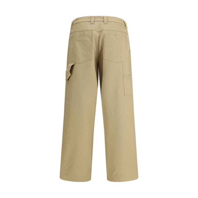 Beige Cotton Casual PantsGucci’s cotton Pants combine a functional design with a distinctive aesthetic. Featuring an all-over GG pattern, they feature belt loops, a carpenter-style pocket and back pockets. The button and zipper closure completes the look