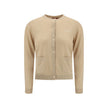 Beige Cashmere CardiganGucci’s cashmere Cardigan is a timeless garment, the epitome of elegance and comfort. Featuring a ribbed crew neck, hem and cuffs, it has a front button closure and two small patch pockets on the front. The iconic stitched signature