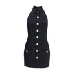 Black Fleece Wool Casual DressBalmain’s Sleeveless Short Dress is a garment with a structured cut and strong elegance. Featuring a classic collar and embossed buttons reminiscent of the house’s iconic style, it has two welt pockets on the front that add a
