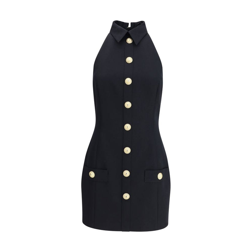Black Fleece Wool Casual DressBalmain’s Sleeveless Short Dress is a garment with a structured cut and strong elegance. Featuring a classic collar and embossed buttons reminiscent of the house’s iconic style, it has two welt pockets on the front that add a