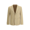 Beige Cotton BlazerGucci’s GG jacquard blazer is an elegant and distinctive piece made of jacquard fabric with the iconic GG pattern. Fully lined, it features a single-breasted button closure, notch lapels, a chest pocket and two front pockets. A perfect