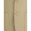 Beige Cotton BlazerGucci’s GG jacquard blazer is an elegant and distinctive piece made of jacquard fabric with the iconic GG pattern. Fully lined, it features a single-breasted button closure, notch lapels, a chest pocket and two front pockets. A perfect