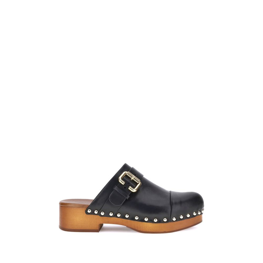 Black Calf Leather Bos Taurus ClogsChloé’s Jeannette Mules reinterpret the classic clog model with a bold, contemporary style. Made of soft calfskin, they feature a solid wooden platform and a low wide heel for stability and comfort. The round toe, golden