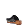 Black Calf Leather Bos Taurus ClogsChloé’s Jeannette Mules reinterpret the classic clog model with a bold, contemporary style. Made of soft calfskin, they feature a solid wooden platform and a low wide heel for stability and comfort. The round toe, golden