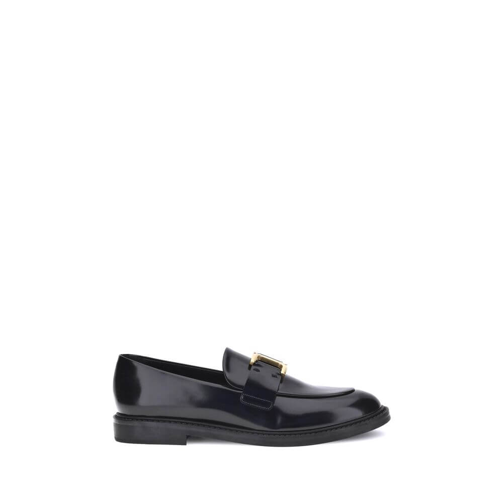 Black Calf Leather Bos Taurus Slip-On LoafersMarcie Loafers by Chloé combine classic elegance with refined details. Crafted with a glossy finish, they are embellished with refined gold-tone detailing and embossed stitching that enhance their craftsmanship