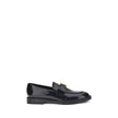Black Calf Leather Bos Taurus Slip-On LoafersMarcie Loafers by Chloé combine classic elegance with refined details. Crafted with a glossy finish, they are embellished with refined gold-tone detailing and embossed stitching that enhance their craftsmanship