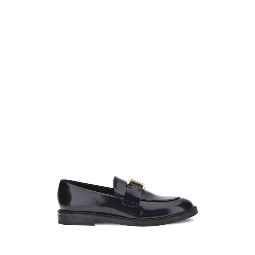Black Calf Leather Bos Taurus Slip-On LoafersMarcie Loafers by Chloé combine classic elegance with refined details. Crafted with a glossy finish, they are embellished with refined gold-tone detailing and embossed stitching that enhance their craftsmanship