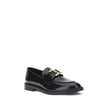 Black Calf Leather Bos Taurus Slip-On LoafersMarcie Loafers by Chloé combine classic elegance with refined details. Crafted with a glossy finish, they are embellished with refined gold-tone detailing and embossed stitching that enhance their craftsmanship