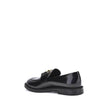Black Calf Leather Bos Taurus Slip-On LoafersMarcie Loafers by Chloé combine classic elegance with refined details. Crafted with a glossy finish, they are embellished with refined gold-tone detailing and embossed stitching that enhance their craftsmanship
