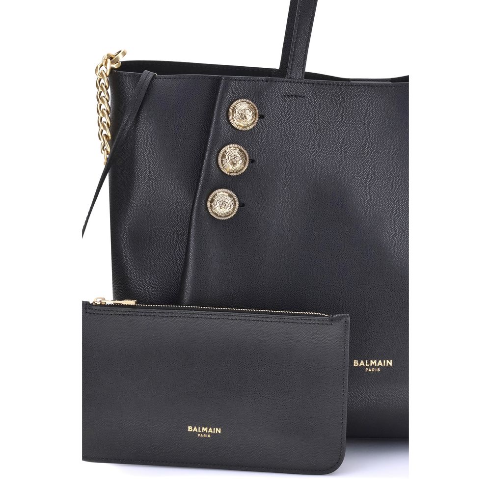 Black Calf Leather Bos Taurus Shoulder BagBalmain’s Emblème leather Tote Bag has a structured and elegant design. Equipped with two flat top handles, it features a trompe-l’œil magnetic button closure, enriched with three decorative gold metal 