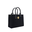 Black Cotton Shoulder BagCotton Shoulder Bag by Versace, rigid leather top handles, removable flat shoulder strap, top button closure, single interior compartment, iconic brand monogram embossed on front, leather feet at base, iconic Medusa embossed appli