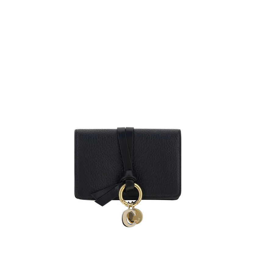 Black Calf Leather Bos Taurus WalletAlphabet by Chloé Wallet in grained leather, elegant and functional. Featuring a charm detail that adds a touch of personality, it has a snap-button closure for security and convenience. Inside, it features a main compa