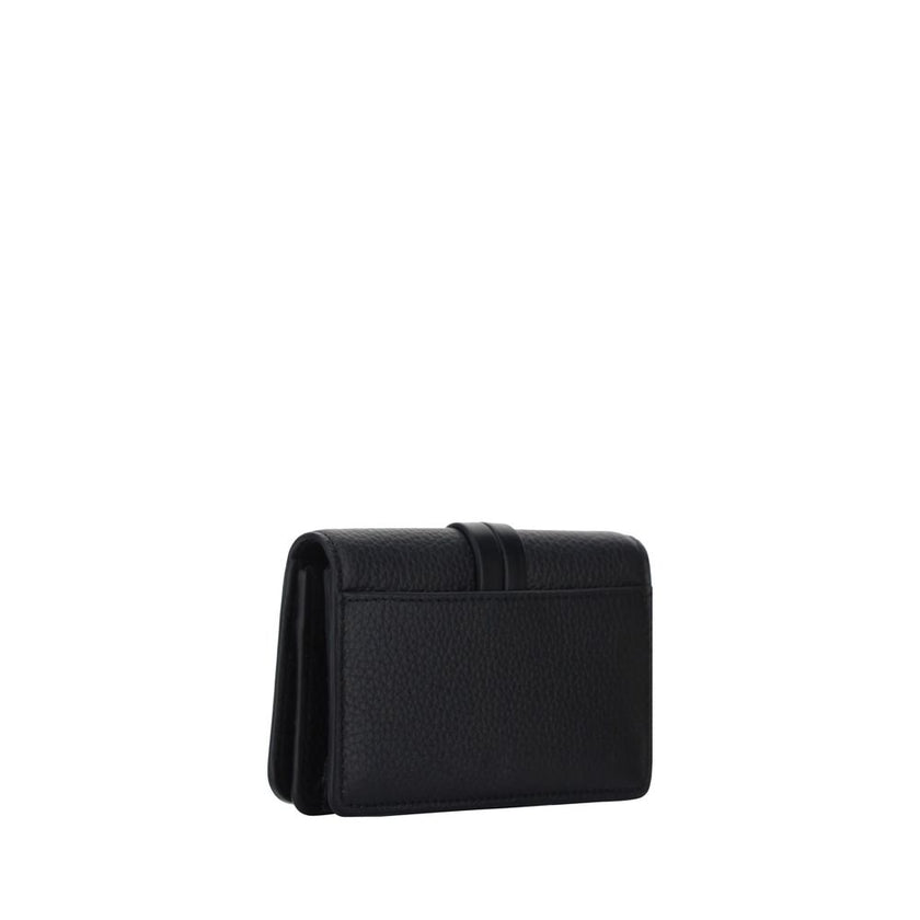 Black Calf Leather Bos Taurus WalletAlphabet by Chloé Wallet in grained leather, elegant and functional. Featuring a charm detail that adds a touch of personality, it has a snap-button closure for security and convenience. Inside, it features a main compa
