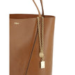 Brown Calf Leather Bos Taurus Shoulder BagLeather Spin Shoulder Bag by Chloé is a refined and modern accessory featuring a sleek grained leather design. The two flat top handles offer a comfortable and practical grip, while the brand’s iconic monogram, pr